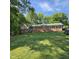 Beautifully landscaped front yard with a charming single-story home, offering great curb appeal at 1102 Parkwood Dr, Siler City, NC 27344