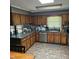 Well-lit kitchen featuring granite countertops, mosaic backsplash, and stainless steel appliances at 1102 Parkwood Dr, Siler City, NC 27344