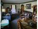 Cozy living room featuring comfortable seating, wooden furniture, and natural light at 1102 Parkwood Dr, Siler City, NC 27344