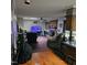 Spacious living room with a brick fireplace and cozy seating area at 1102 Parkwood Dr, Siler City, NC 27344