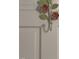 The bedroom door features a hook decorated with painted floral art at 112 Hilton Ave, Durham, NC 27707