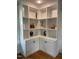 Detailed view of custom-built shelving units with cabinets at 112 Hilton Ave, Durham, NC 27707