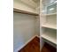 A white closet with shelving and a rod at 112 Hilton Ave, Durham, NC 27707