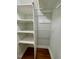 A white closet with adjustable shelving and a rod at 112 Hilton Ave, Durham, NC 27707