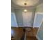 Inviting foyer features a traditional white front door, hardwood floors, and decorative lighting fixture at 112 Hilton Ave, Durham, NC 27707