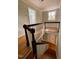 View of a two-story foyer with stained wood bannister and blue walls in the background at 112 Hilton Ave, Durham, NC 27707