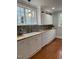 Charming kitchen boasts butcher block counters, white cabinets, and modern backsplash at 112 Hilton Ave, Durham, NC 27707
