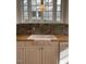 Kitchen featuring butcher block counters, a white sink, and a stainless steel faucet at 112 Hilton Ave, Durham, NC 27707