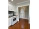 Charming kitchen with butcher block counters, white cabinets and access to outside at 112 Hilton Ave, Durham, NC 27707