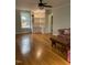 Living room with hardwood floors, built-in shelving, and furniture at 112 Hilton Ave, Durham, NC 27707