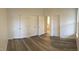 Bedroom with hardwood floors and multiple closets at 113 Conner Dr # 203, Chapel Hill, NC 27514