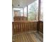 Exterior wooden deck, enclosed with wooden railing, providing an outdoor space at 113 Conner Dr # 203, Chapel Hill, NC 27514