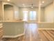 Open living area with abundant natural light and access to the kitchen at 113 Conner Dr # 203, Chapel Hill, NC 27514