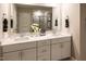 Bright bathroom with double sinks, quartz countertops, and a walk-in shower at 1139 Winding Spring Dr, Mebane, NC 27302