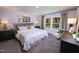 Cozy bedroom with large windows, comfortable bedding, and stylish decor at 1139 Winding Spring Dr, Mebane, NC 27302