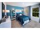 Charming bedroom with blue accent wall, playful Pac-Personal decor, and a cozy bed with matching blue bedding at 1139 Winding Spring Dr, Mebane, NC 27302
