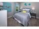 Cozy bedroom featuring a bed with gray bedding, nightstands, and whimsical wall decor at 1139 Winding Spring Dr, Mebane, NC 27302