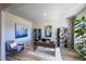 Well-decorated home office with a modern desk, cozy chair, and decorative shelving at 1139 Winding Spring Dr, Mebane, NC 27302