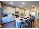 Bright, modern kitchen featuring stainless steel appliances, granite countertops, and a breakfast bar at 1139 Winding Spring Dr, Mebane, NC 27302