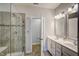 Modern bathroom features double sinks and a tiled shower at 124 Shale Creek Dr, Durham, NC 27703