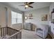 Bright Bedroom with neutral tones, a crib, and comfortable seating at 124 Shale Creek Dr, Durham, NC 27703