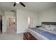 The primary bedroom's interior has neutral tones, a ceiling fan, and multiple windows for plenty of natural light at 124 Shale Creek Dr, Durham, NC 27703