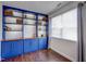 Bonus room with custom, built-in shelving and storage illuminated by natural light from a nearby window at 124 Shale Creek Dr, Durham, NC 27703