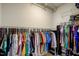 Walk-in closet with ample hanging space, shelves, and shoe storage at 124 Shale Creek Dr, Durham, NC 27703