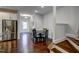 Bright dining area features hardwood floors, a modern table, and an open floor plan for easy entertaining at 124 Shale Creek Dr, Durham, NC 27703