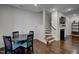 Dining room with stairs leading to upstairs and fireplace at 124 Shale Creek Dr, Durham, NC 27703