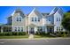 Charming townhomes with varied color schemes, tidy lawns, and well-maintained landscaping in a pleasant neighborhood setting at 124 Shale Creek Dr, Durham, NC 27703