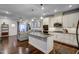 Open-concept kitchen features an island, granite countertops, stainless appliances, and easy access to the living area at 124 Shale Creek Dr, Durham, NC 27703