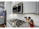 Close up of kitchen with stainless steel gas range and granite countertops at 124 Shale Creek Dr, Durham, NC 27703