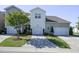 Rear exteriors of townhomes showcasing driveways and garage doors at 124 Shale Creek Dr, Durham, NC 27703