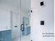 Bathroom featuring walk-in shower, vanity with drawers, and pendant lighting at 12845 Mallard Rock Rd, Zebulon, NC 27597
