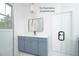 Bathroom vanity with drawers, mirror, and pendant light at 12845 Mallard Rock Rd, Zebulon, NC 27597