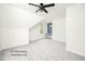 Spacious bedroom featuring a vaulted ceiling, neutral color palette, and a built-in desk at 12845 Mallard Rock Rd, Zebulon, NC 27597