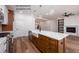 The kitchen features a large island with a stainless steel dishwasher and white farmhouse sink at 12845 Mallard Rock Rd, Zebulon, NC 27597