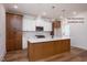 Spacious kitchen featuring a large island with quartz countertops and stainless steel appliances at 12845 Mallard Rock Rd, Zebulon, NC 27597