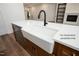 The kitchen features a white farmhouse sink, black faucet, and stainless steel dishwasher at 12845 Mallard Rock Rd, Zebulon, NC 27597