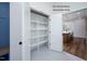 Walk-in pantry with ample shelving for storage at 12845 Mallard Rock Rd, Zebulon, NC 27597