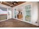 Covered patio with wood ceiling overlooking a view of the kitchen and living area at 12845 Mallard Rock Rd, Zebulon, NC 27597