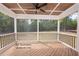 Large screened-in porch with a ceiling fan at 12845 Mallard Rock Rd, Zebulon, NC 27597