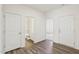 Bright entryway featuring wood floors, a bathroom, and direct access to additional rooms at 149 Gladstone Loop, Clayton, NC 27520
