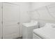 A well-lit laundry room featuring modern appliances and ample storage space at 149 Gladstone Loop, Clayton, NC 27520