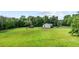 Aerial view of the home, shed and expansive lawn at 1510 Asbury Church Rd, Sanford, NC 27330