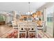 Bright dining area open to kitchen and living area features wooden table at 1510 Asbury Church Rd, Sanford, NC 27330