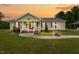 Charming single-story home featuring a covered front porch and well-manicured lawn at 1510 Asbury Church Rd, Sanford, NC 27330