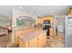 The kitchen features ample countertop space, black appliances, and tile flooring at 1510 Asbury Church Rd, Sanford, NC 27330