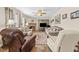 Comfortable living room offers a brick fireplace and neutral color palette at 1510 Asbury Church Rd, Sanford, NC 27330